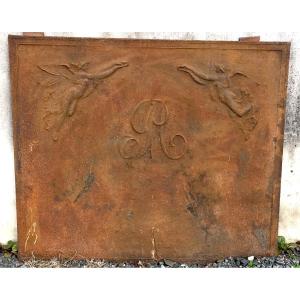 Large Cast Iron Fireback With Central Monogram And Winged Women. Early 19th Century.