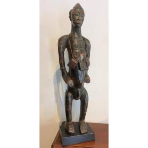Senufo Wooden Statue With Dark Patina. Republic Of Ivory Coast, Early 20th Century.