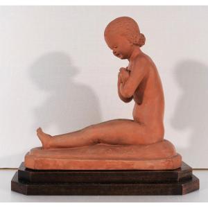 René MEYNIAL (1897-1996) Jeune fille assise à l'oiseau, sculpture, terre cuite, circa 1930