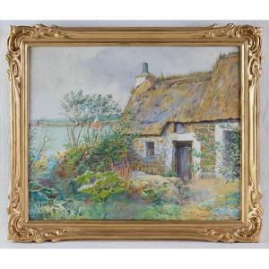 "breton Cottage On The Edge Of A River."