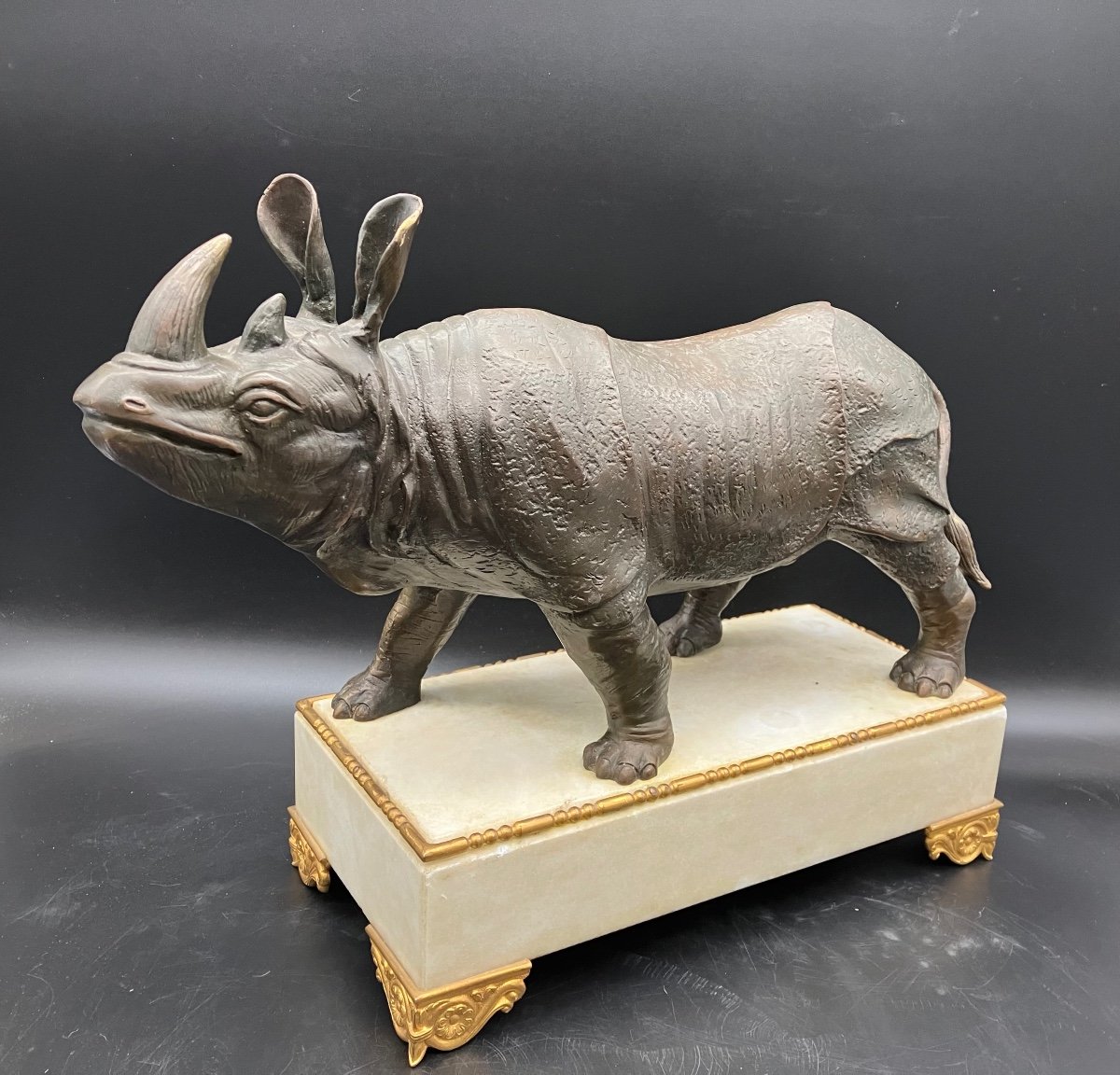 Bronze Rhinoceros On White Marble Base -photo-3