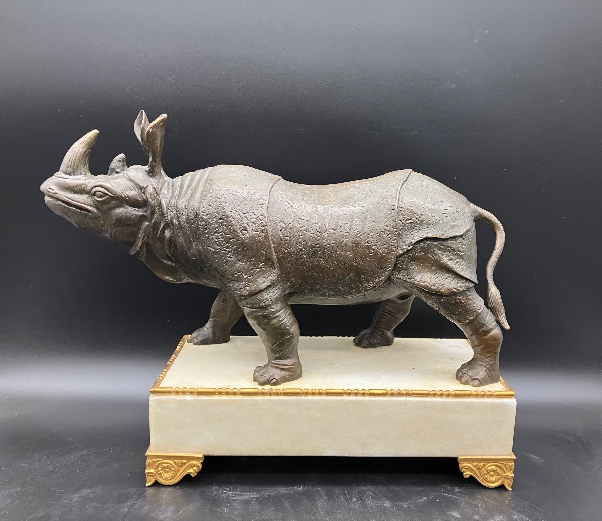 Bronze Rhinoceros On White Marble Base 