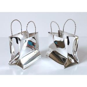 A Pair Of Cartier Solid Silver Miniature Bags 