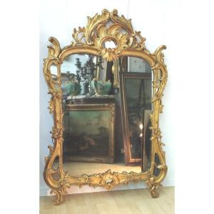 Miroir en bois doré  à parecloses d' époque Louis XV
