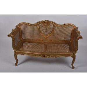 Small Louis XV Style Sofa In Gilded Wood, With Cane Bottom.  L. 132 Cm