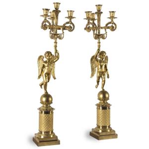 A Pair Of French Empire Ormolu Candelabra With Putti