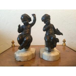 Pair Of Puttis In Patinated Bronze