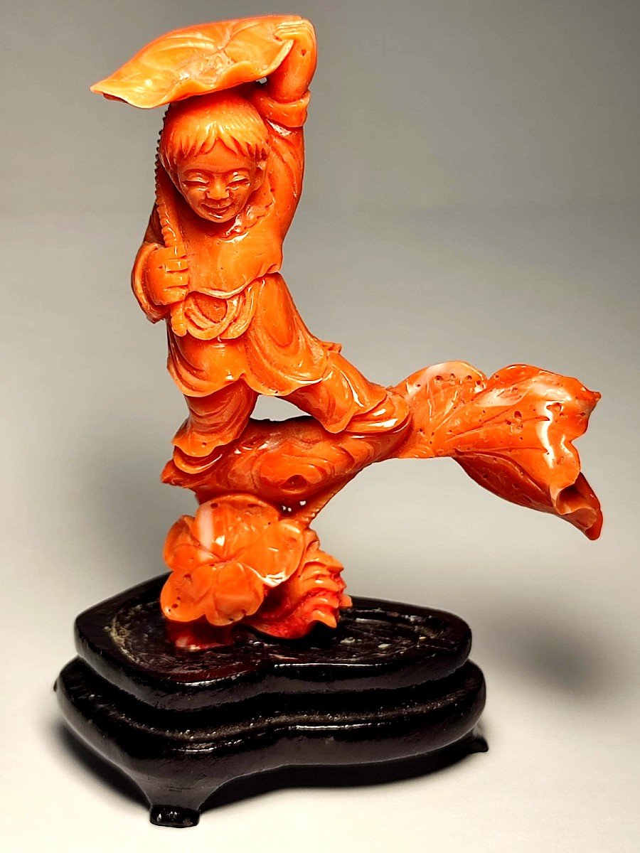 Carved Coral Depicting A Child Sheltering Under A Leaf. China, Early 1900s