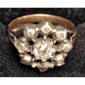 Gold 'flower' Ring And Cup With Central Antique Cut Brilliant 0.30 Surrounded By Diamonds.  