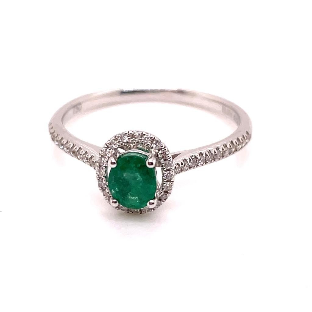 White Gold Emerald Ring Surrounded By Diamonds