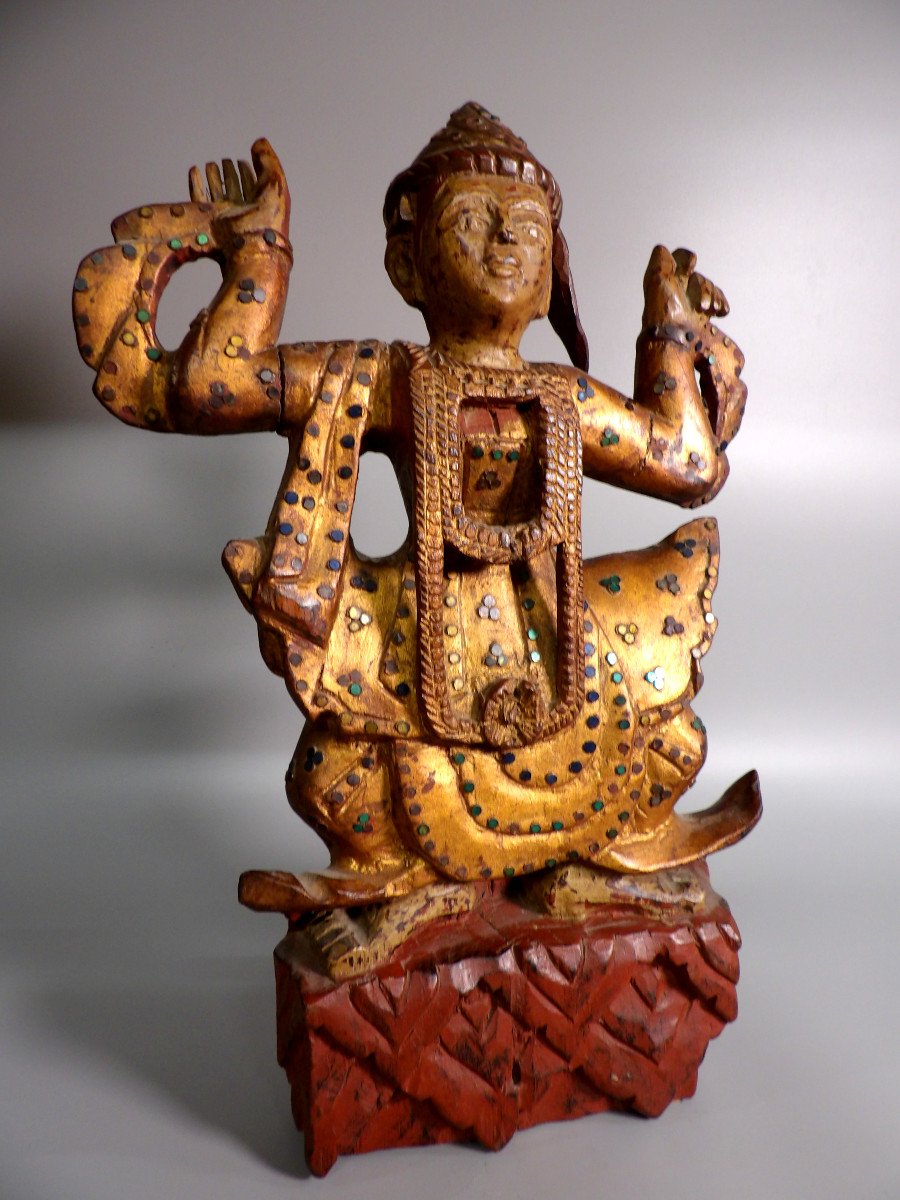 Ethnic Sculpture In Golden Wood