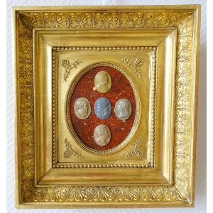 Antique Cameos In An Empire Frame, Souvenir Of The Grand Tour On Porphyry Background