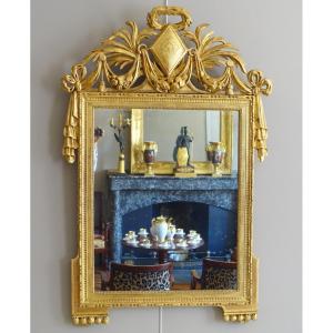 Large Louis XVI Period Mirror In Carved And Gilded Wood 