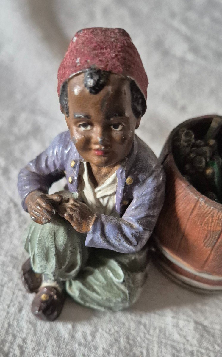 Orientalist Subject Boy Seated Beside A Barrel Forming A Pyrogenic Match Holder -photo-2