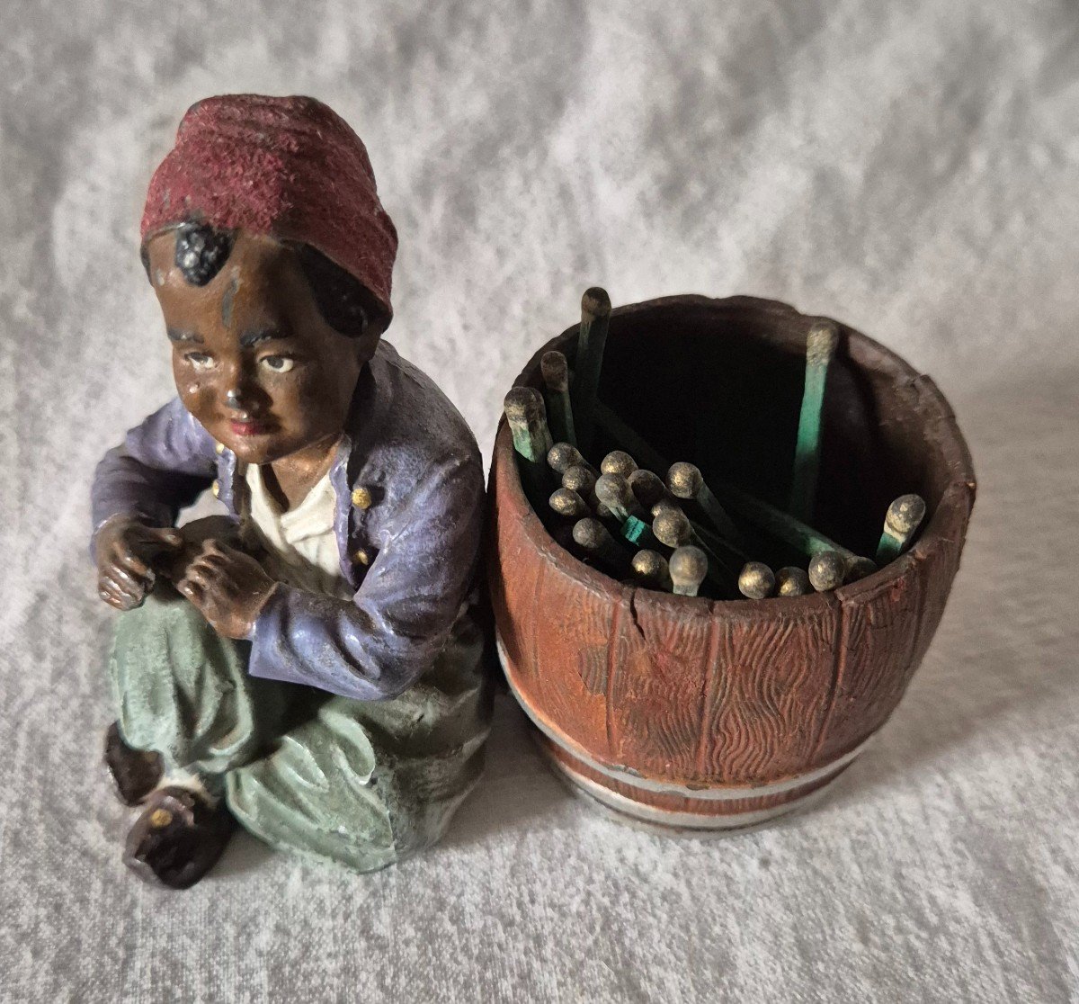 Orientalist Subject Boy Seated Beside A Barrel Forming A Pyrogenic Match Holder -photo-4