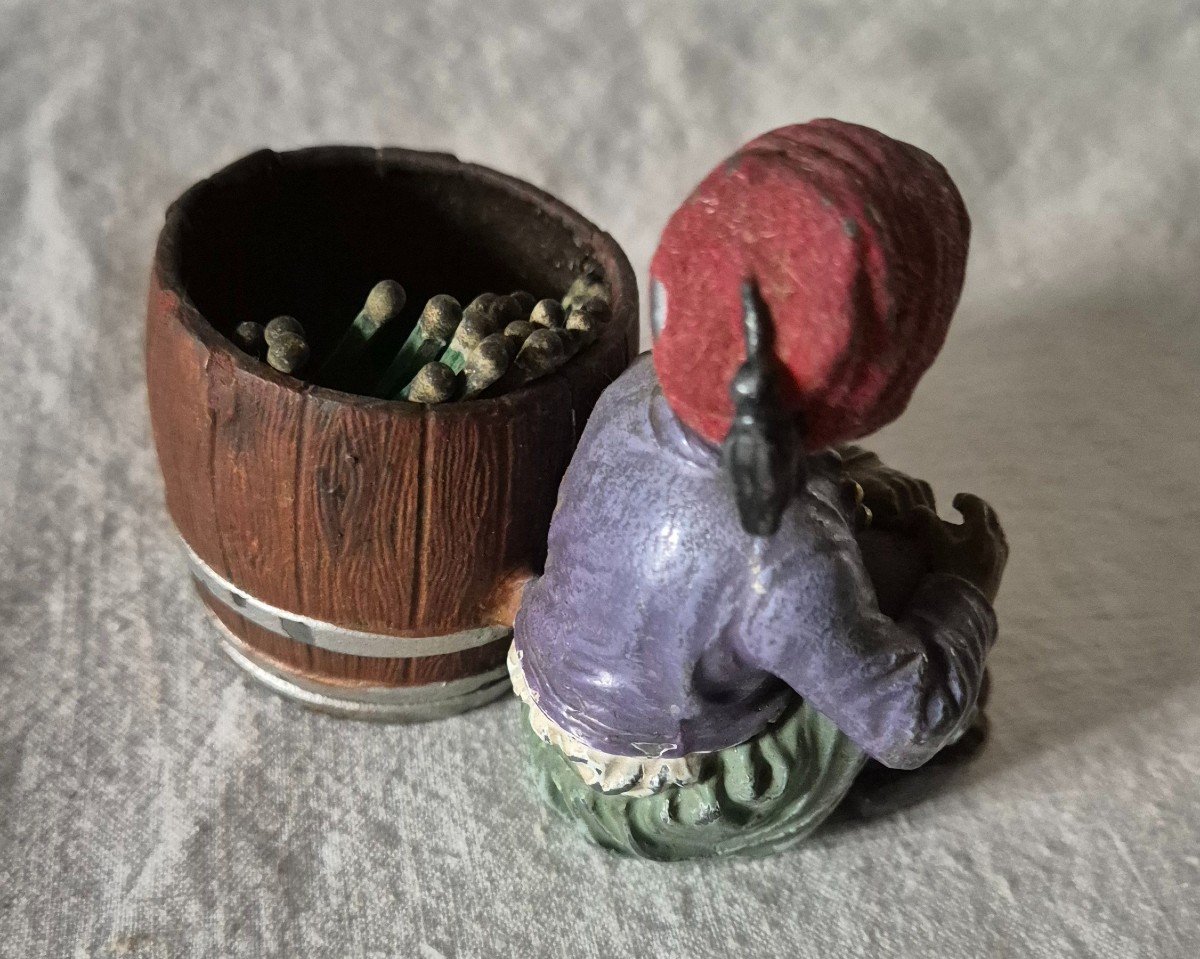 Orientalist Subject Boy Seated Beside A Barrel Forming A Pyrogenic Match Holder -photo-1