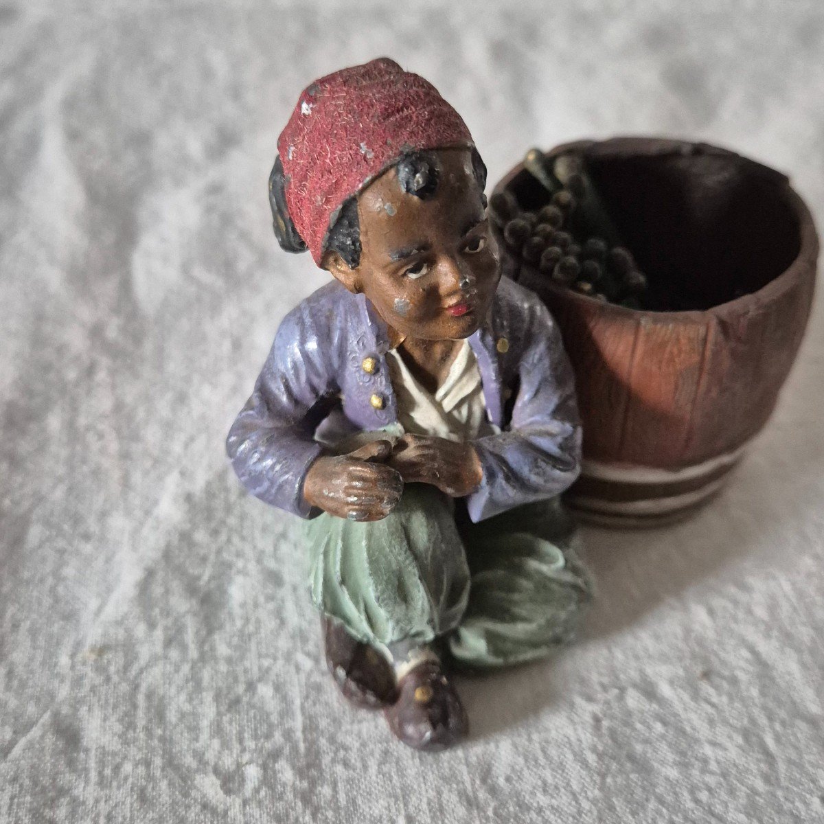 Orientalist Subject Boy Seated Beside A Barrel Forming A Pyrogenic Match Holder -photo-2