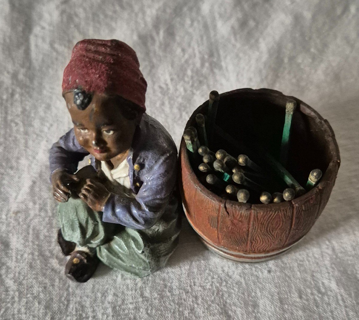 Orientalist Subject Boy Seated Beside A Barrel Forming A Pyrogenic Match Holder -photo-5