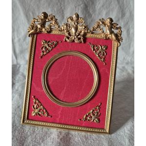 Gilded Bronze Photo Frame With Cherub Decor And Red Moire Mat 