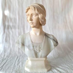 Bust Of Young Woman With Blue Corsage