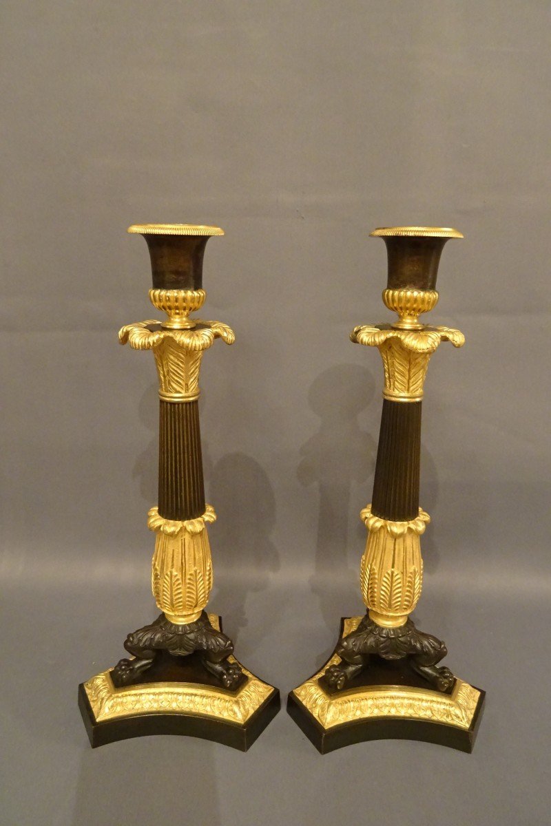 Pair Of Restoration Candlesticks In Gilded And Patinated Bronze