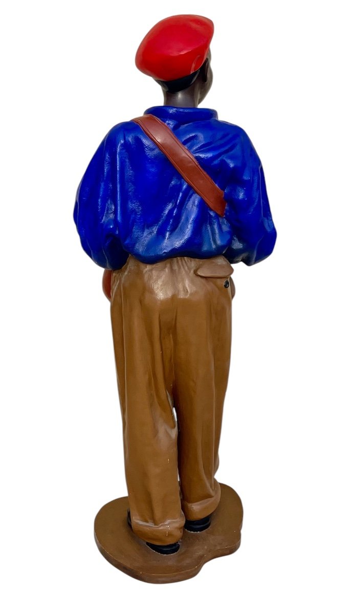 Statue Of A Young African Man Delivering Newspapers-photo-5