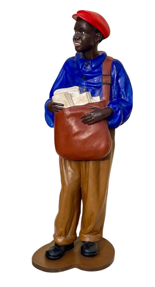 Statue Of A Young African Man Delivering Newspapers-photo-6