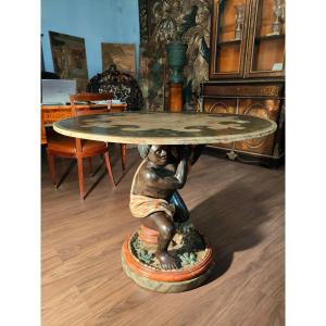 Lacquered Wooden Table Supported By A Painted Venetian Moor