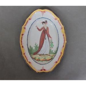 Oval Dish In Faience From Islettes Decorated With A Long Lady. Beginning Of The 19th Century.