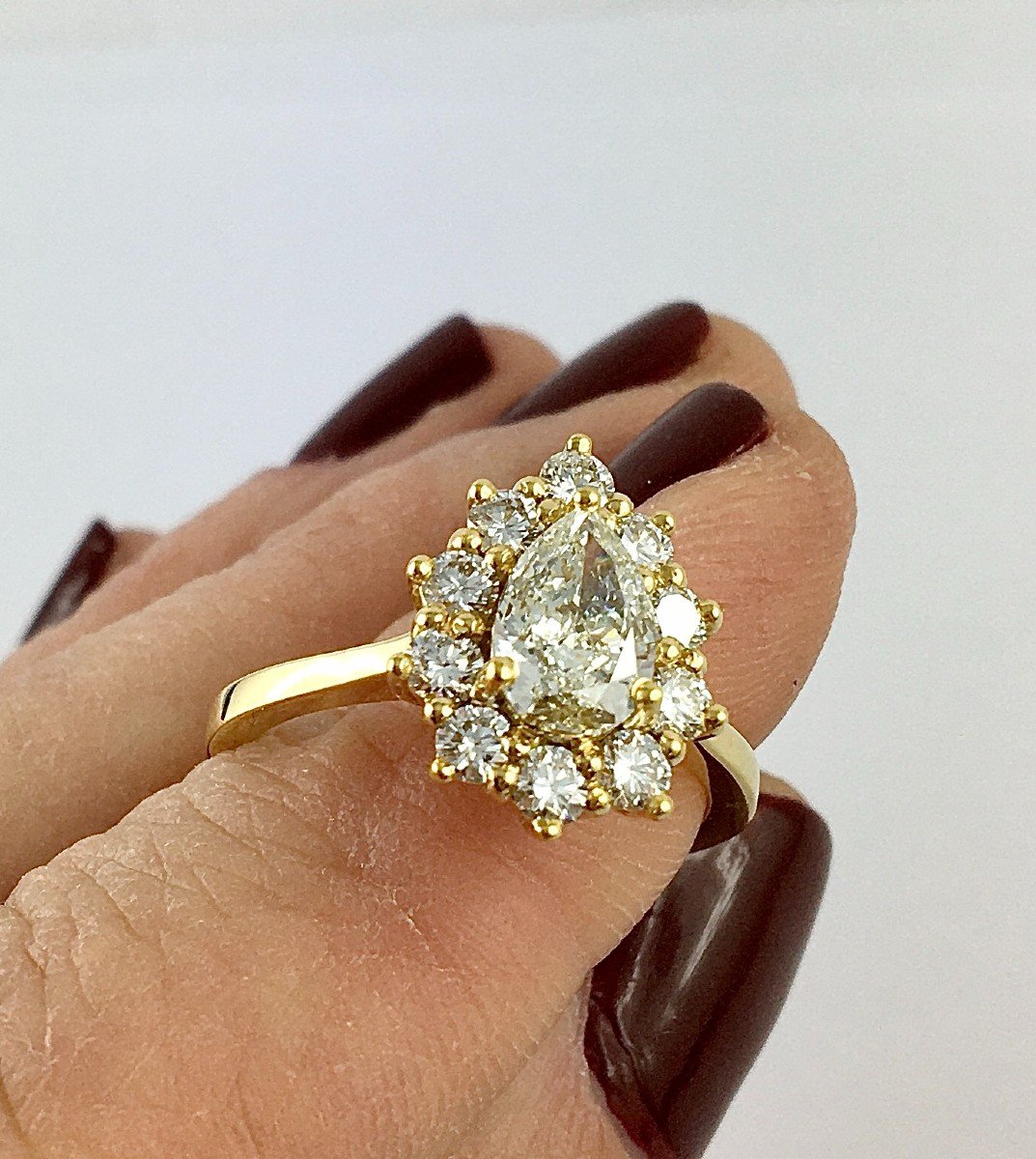 Pear Diamond Ring Surrounded By Diamonds On Yellow Gold-photo-5