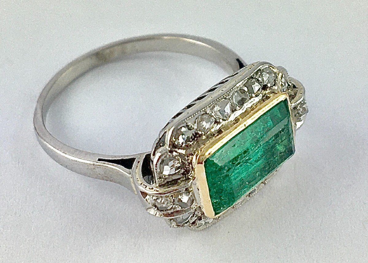 Art Deco Emerald Ring With Cut Sides And Diamond Surrounds On Platinum And Yellow Gold