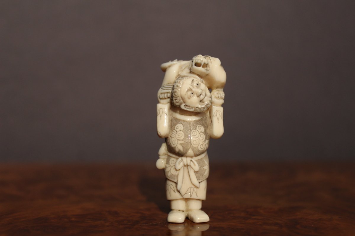 Netsuke Personage Standing Carrying A Dog On His Shoulders