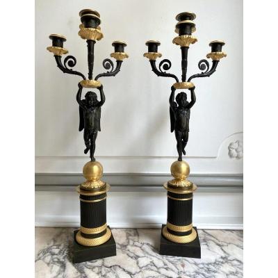 Pair Of Candelabra With Loves Empire Period In Gilt Bronze