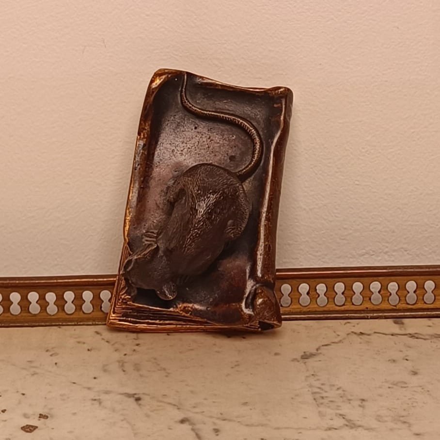 Small Bronze Subject Representing A Mouse Nibbling A Book-photo-1