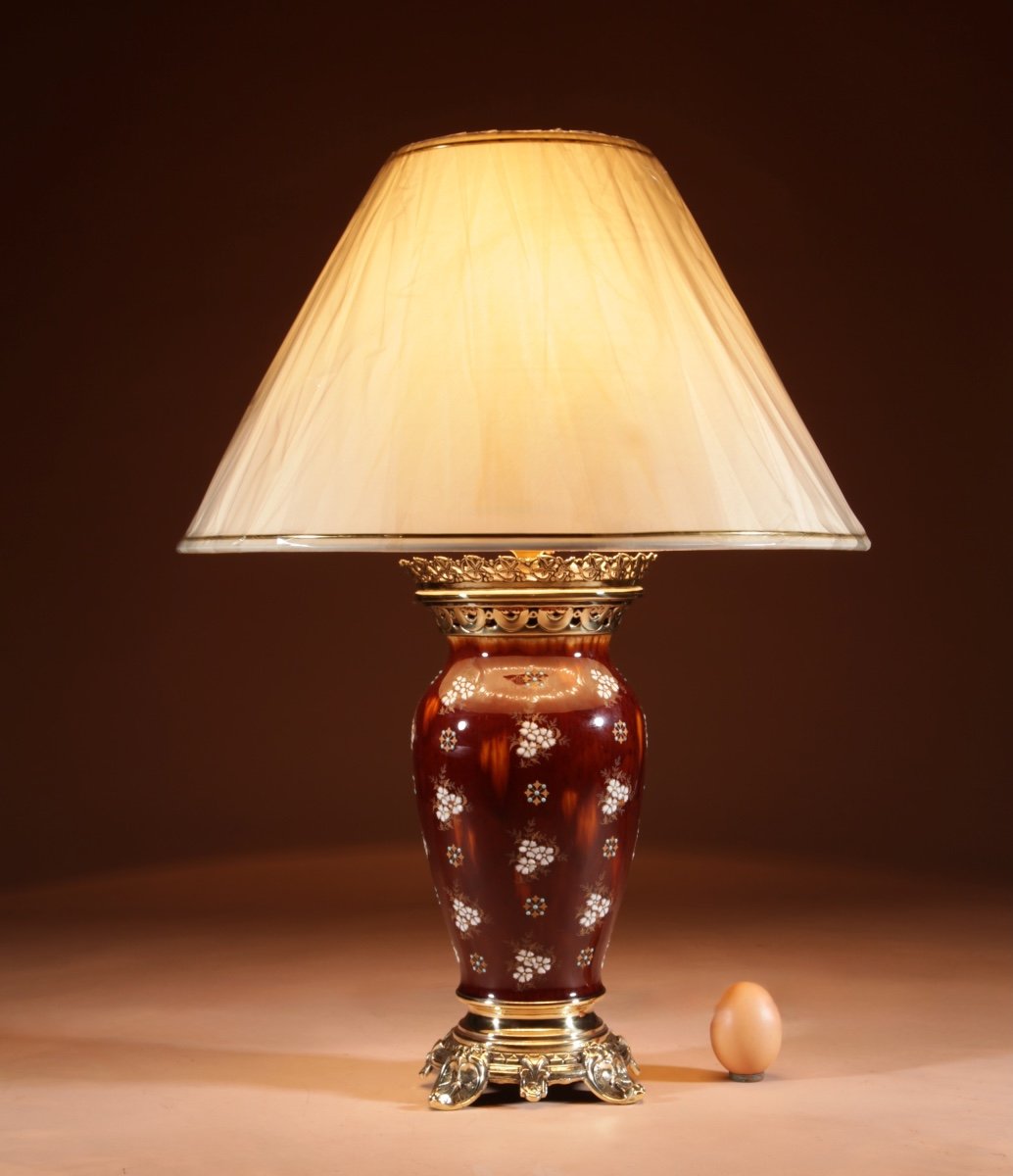 A French Ceramic And Brass Table Lamp.