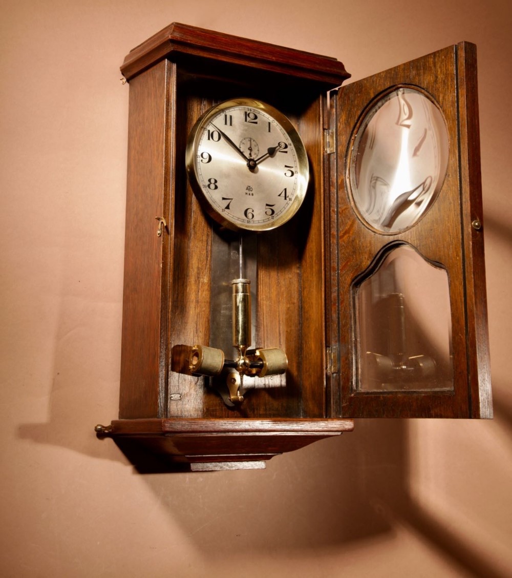  An Early Electrical Ato Haller & Benzing Oak Wall Clock Circa: 1925.-photo-5