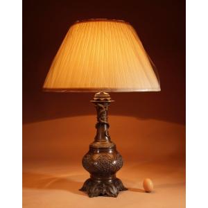 A French Original Patinated White Metal Table Lamp In The Chinese Taste.