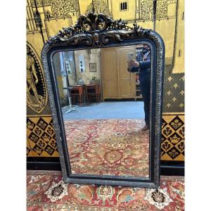 Miroir époque Napoléon III en bois noirci et doré 