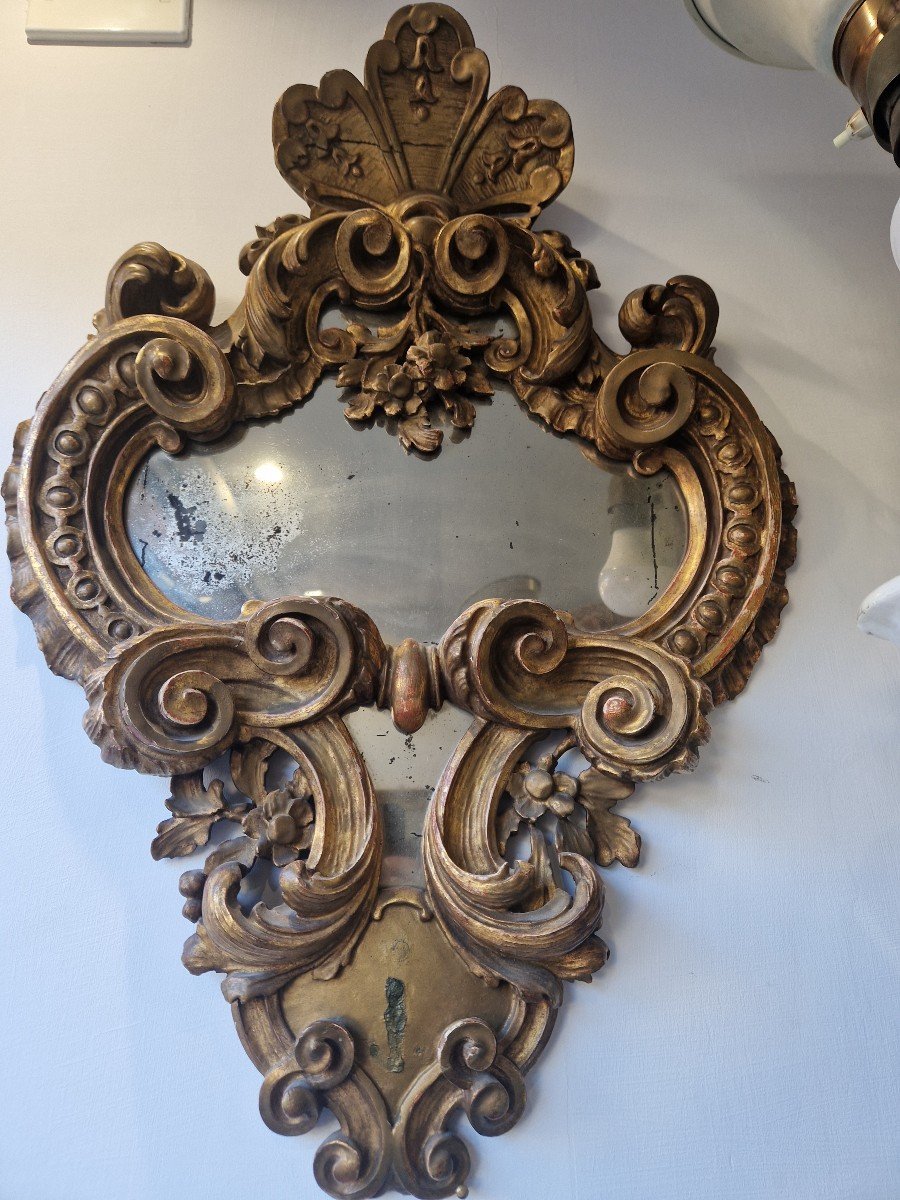 Small 18th Century Italian Gilded Wooden Mirror Gilded Wood And Finely Carved With Rocaille