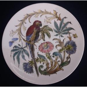 Plat Art Nouveau en faïence décor émaillé au perroquet et papillons-Keller & Guérin Lunéville