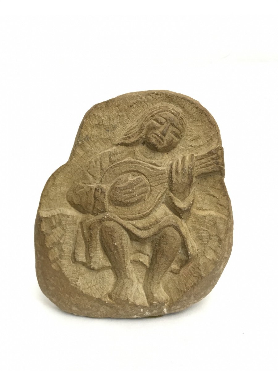 Stone Sculpture Representing A Musician From The Middle Ages-photo-4