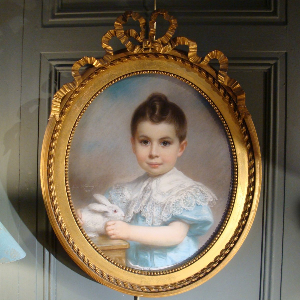 Portrait Of A Little Boy With A Rabbit Dated 1903