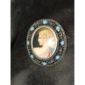 Silver Brooch Decorated With A Painted Miniature In A Surrounding Of Blue Pearls