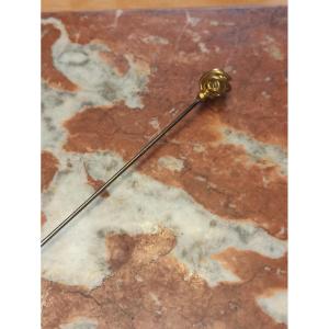 Long Hat Pin Decorated With A Sphere In Golden Brass Circa 1900