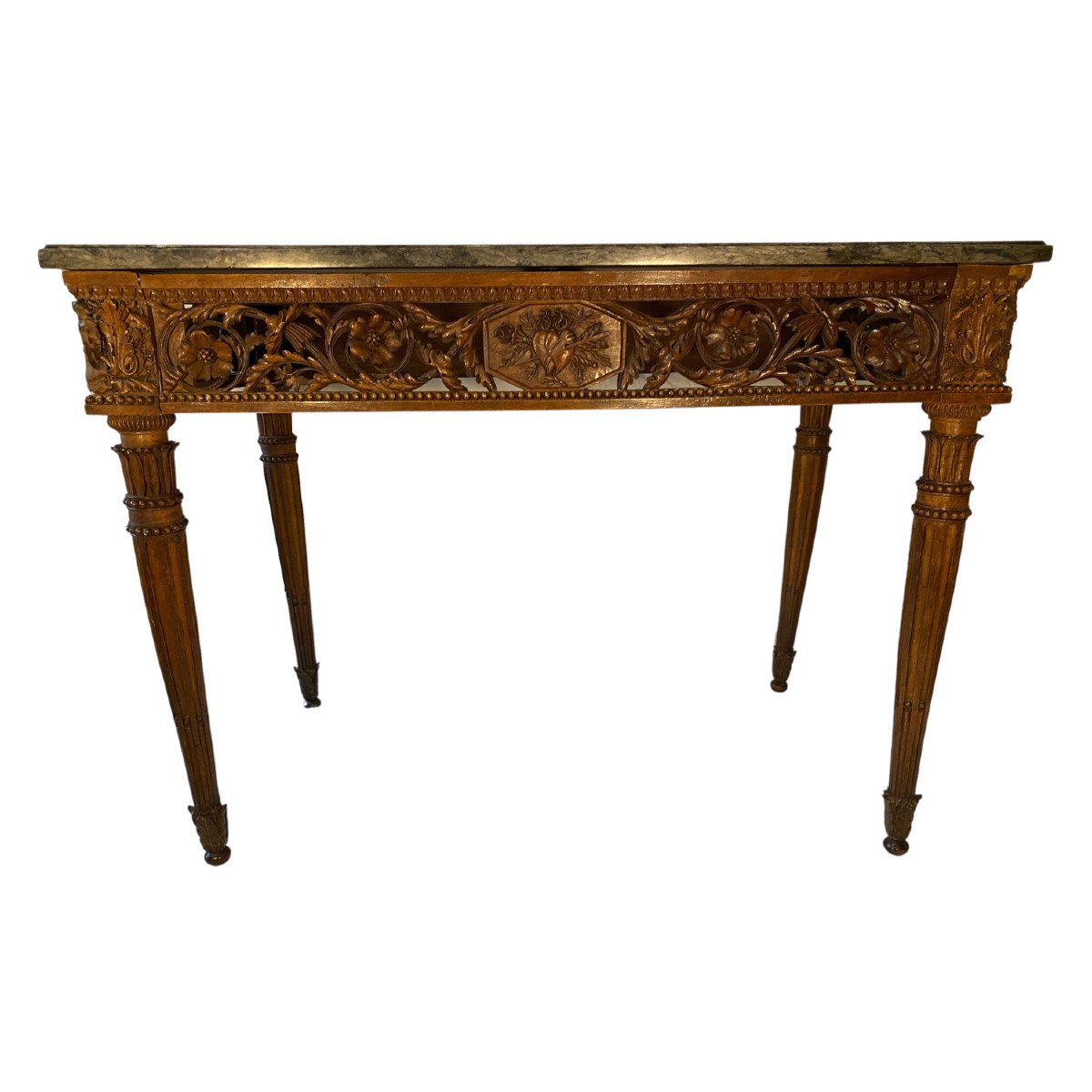 Console louis XVI en noyer reposant sur quatre pieds