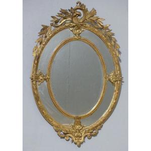 Large Oval Mirror With Parecloses, Napoleon III Period In Wood And Golden Stucco, 19th Century