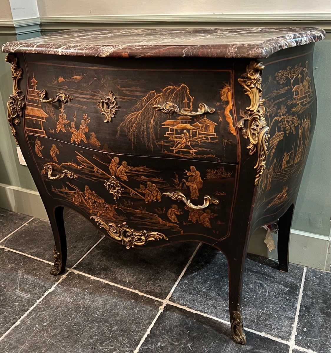 A Louis XV Style Chinese Lacquer Chest Of Drawers With Gilded Bronze Mounts