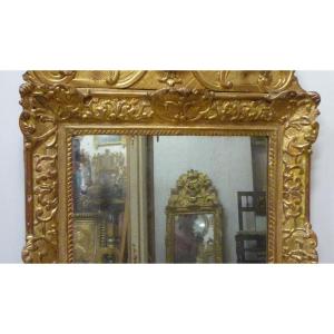 Miroir d'époque Louis XIV en bois sculpté et doré 
