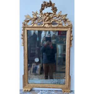 Miroir d'époque Louis XVI en bois doré.