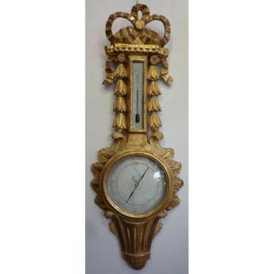 Baromètre de style Louis XV en bois sculpté doré